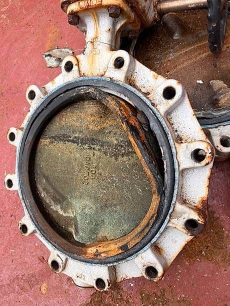 Damaged butterfly valve showing wear that can occur from poor selection or harsh wastewater media